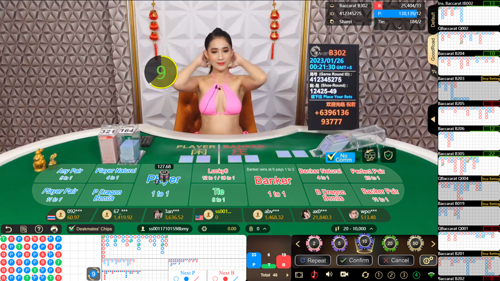 Dealer wearing pink bikini from Allbet Gaming get ready to deal card in Baccarat tables