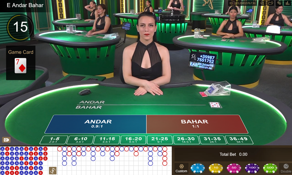 Dealer from SA Gaming seating down ready to deal card in Andar Bahar table