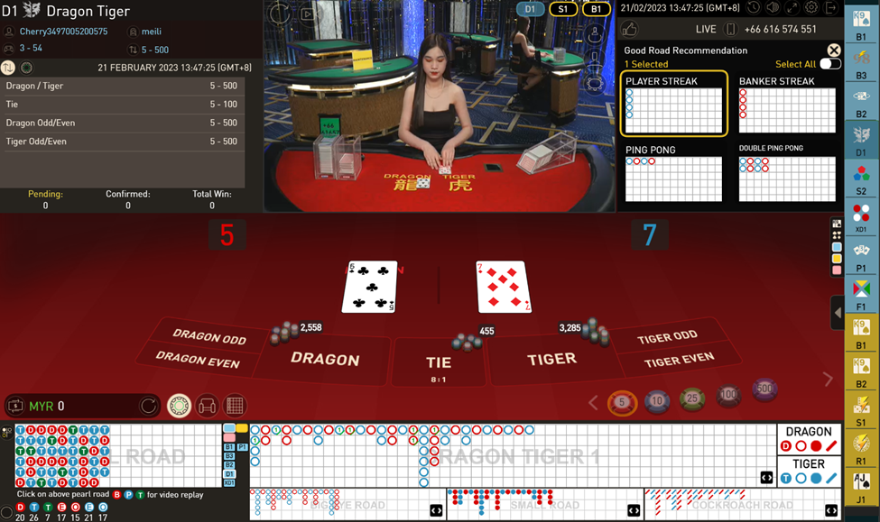 Dealer wearing an Black dress dealing card at Dragon Tiger table from GamePlay Interactive