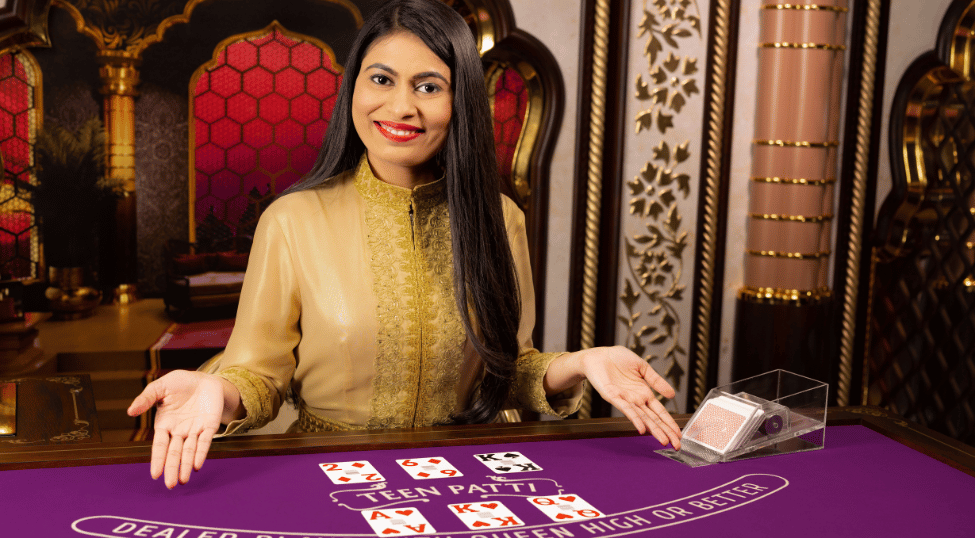 Female dealer dealing card at Teen Patti table by Evolution Gaming